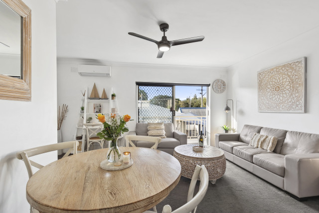 The dining area at Ocean Echoes opens onto the outdoor entertaining deck, creating a light-filled space perfect for shared meals and easy indoor–outdoor living.